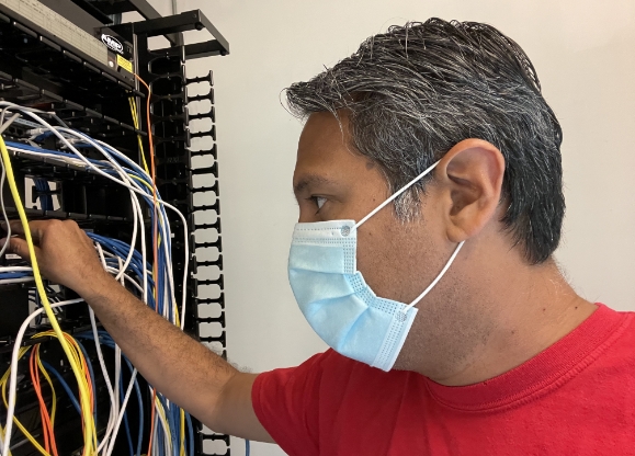 mario castillo electrician working on circuit breaker